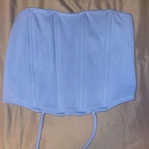 Blue shirt, strapless, open back.  Size S